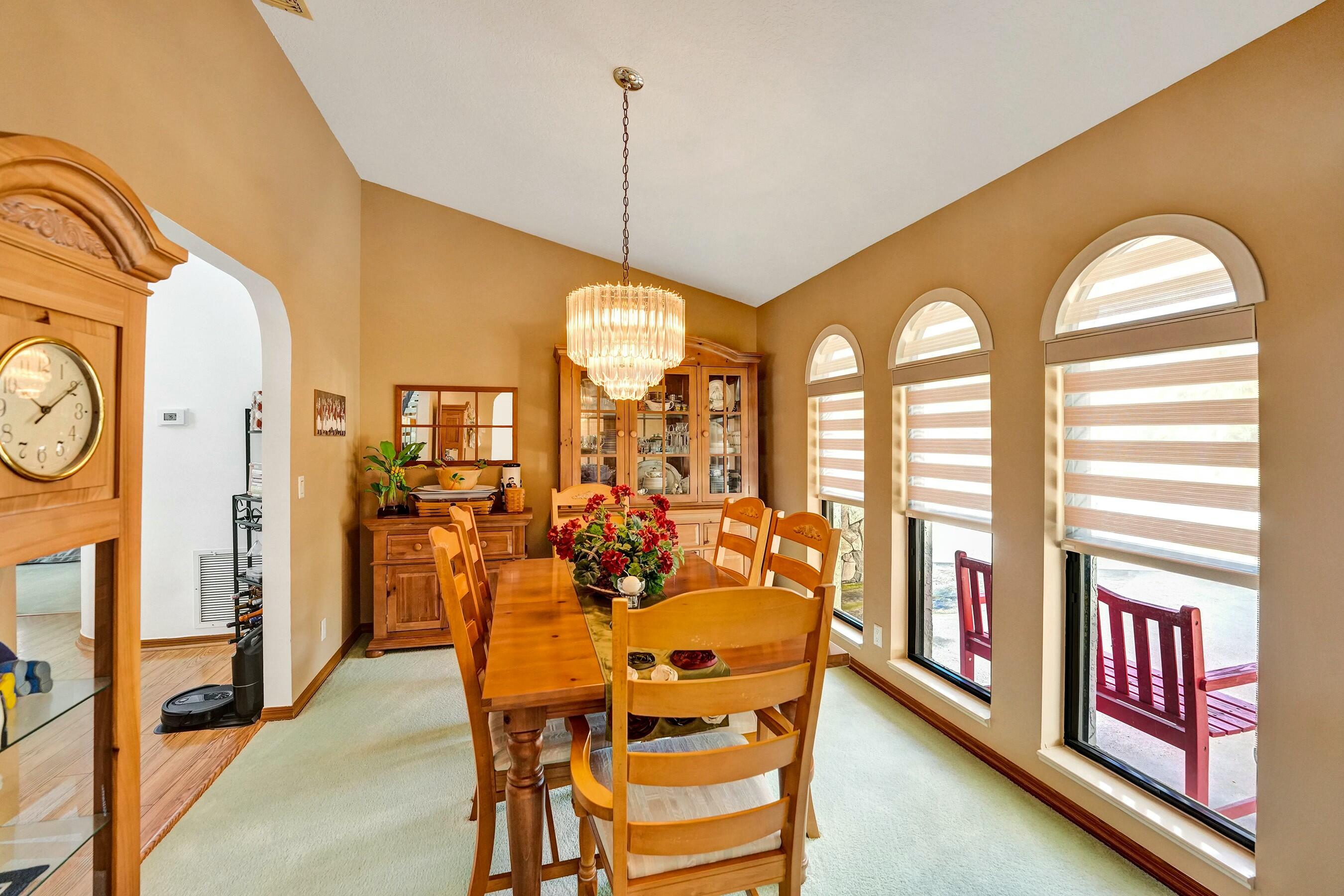 3120 Southeast Downwinds Road Jupiter, FL 33478 - Photo 10 of 33 a view of a dining room with furniture window and wooden floor