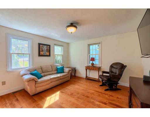 55 Norris Road Tyngsborough, MA 01879 - Photo 13 of 29 a living room with furniture and a window