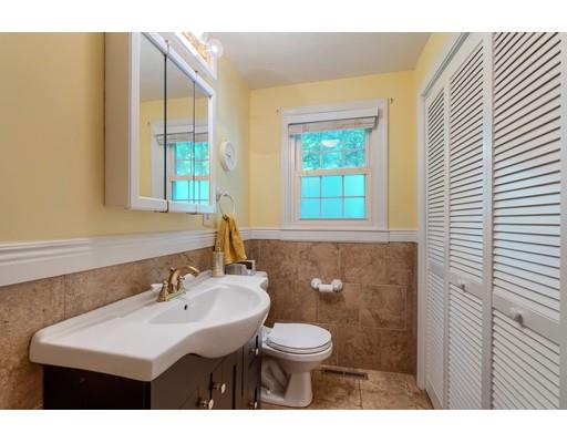 55 Norris Road Tyngsborough, MA 01879 - Photo 14 of 29 a bathroom with a sink a toilet and a mirror