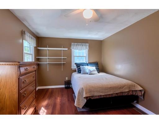 55 Norris Road Tyngsborough, MA 01879 - Photo 19 of 29 a bedroom with a bed and cabinet
