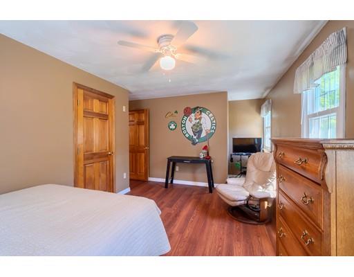 55 Norris Road Tyngsborough, MA 01879 - Photo 20 of 29 a bedroom with a bed and a dresser in it