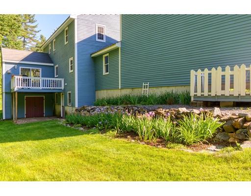 55 Norris Road Tyngsborough, MA 01879 - Photo 2 of 29 a front view of a house with garden