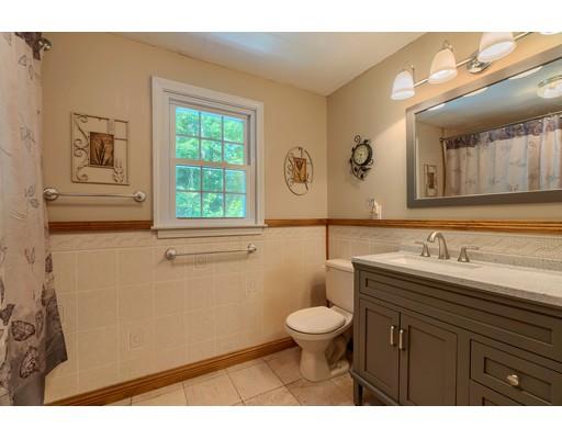 55 Norris Road Tyngsborough, MA 01879 - Photo 23 of 29 a bathroom with a granite countertop sink toilet and mirror