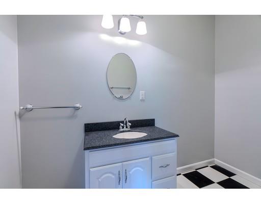 55 Norris Road Tyngsborough, MA 01879 - Photo 29 of 29 a bathroom with a sink and a mirror
