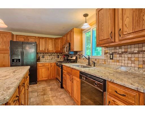 55 Norris Road Tyngsborough, MA 01879 - Photo 4 of 29 a kitchen with a sink cabinets and window