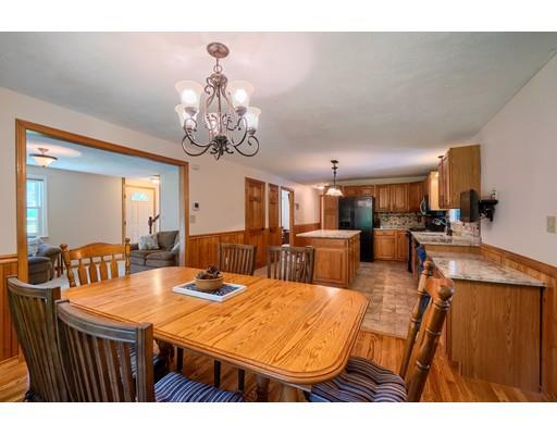 55 Norris Road Tyngsborough, MA 01879 - Photo 5 of 29 a view of a dining room with furniture and a chandelier