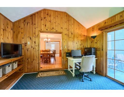 55 Norris Road Tyngsborough, MA 01879 - Photo 8 of 29 a living room with furniture and a flat screen tv