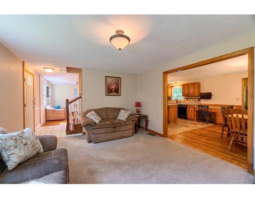 55 Norris Road Tyngsborough, MA 01879 - Photo 9 of 29 a living room with furniture and a large window