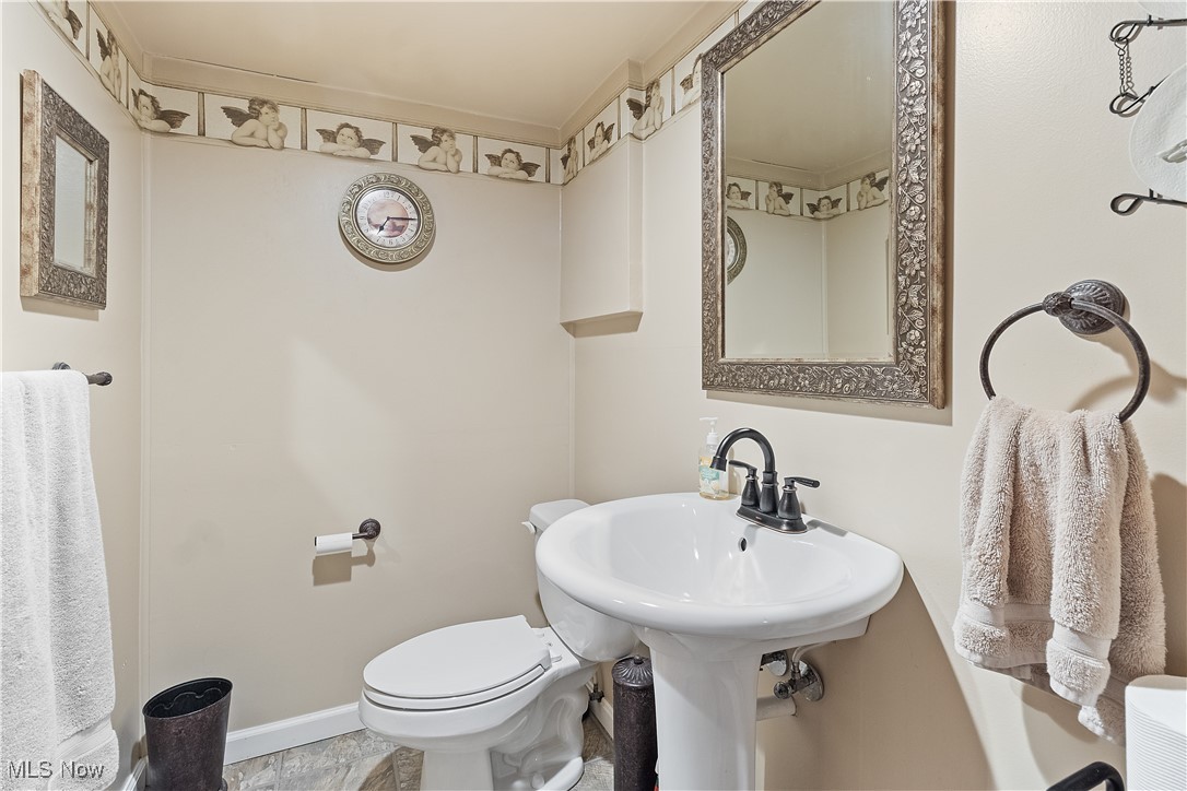 5225 Roseside Avenue Parma, OH 44134 - Photo 22 of 22 Bathroom with baseboards and toilet downstairs
