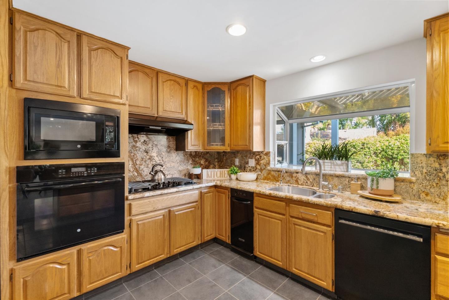 1081 Rockefeller Drive Sunnyvale, CA 94087 - Photo 11 of 24 a kitchen with a sink stove and microwave