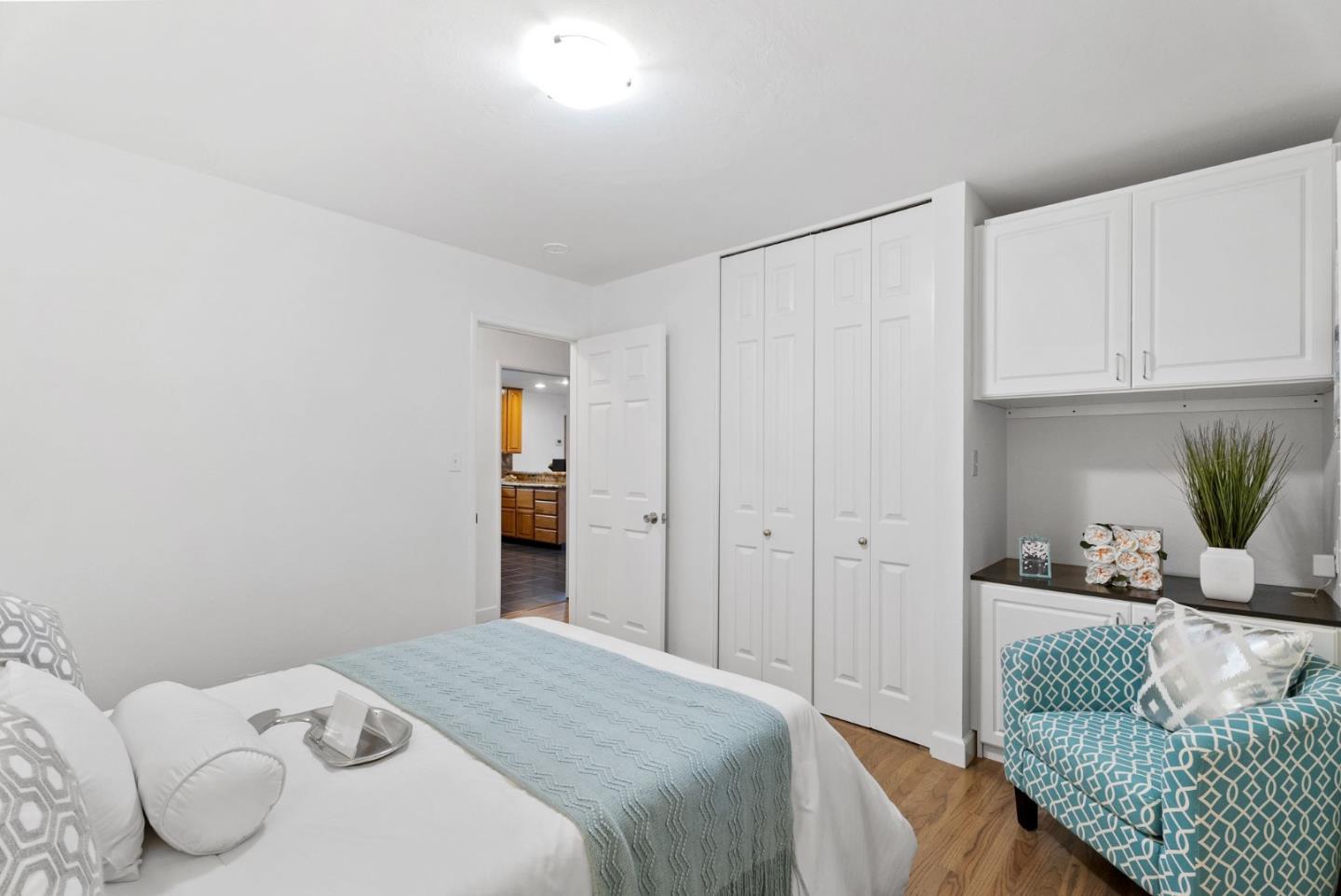 1081 Rockefeller Drive Sunnyvale, CA 94087 - Photo 14 of 24 a bedroom with a bed and a couch