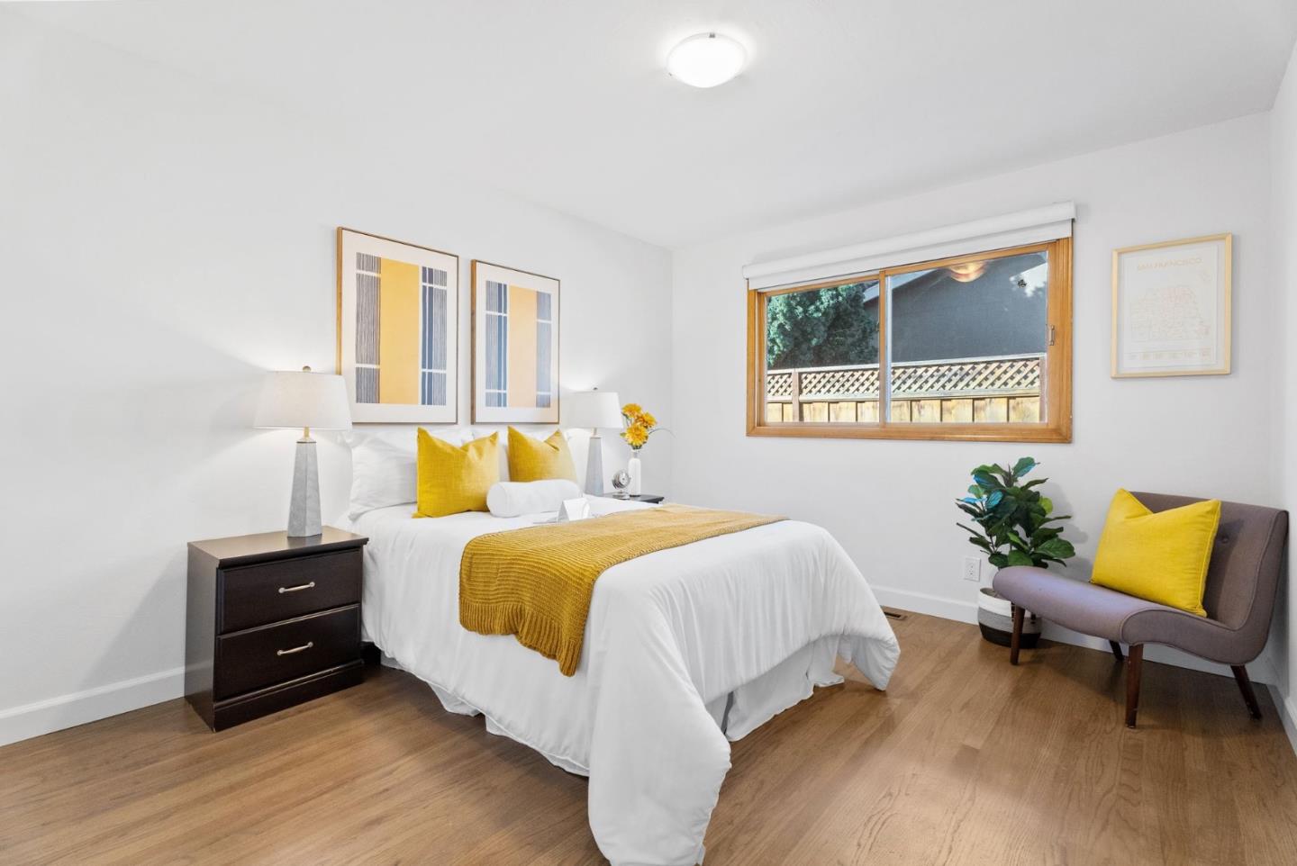 1081 Rockefeller Drive Sunnyvale, CA 94087 - Photo 15 of 24 a bedroom with a bed and wooden floor