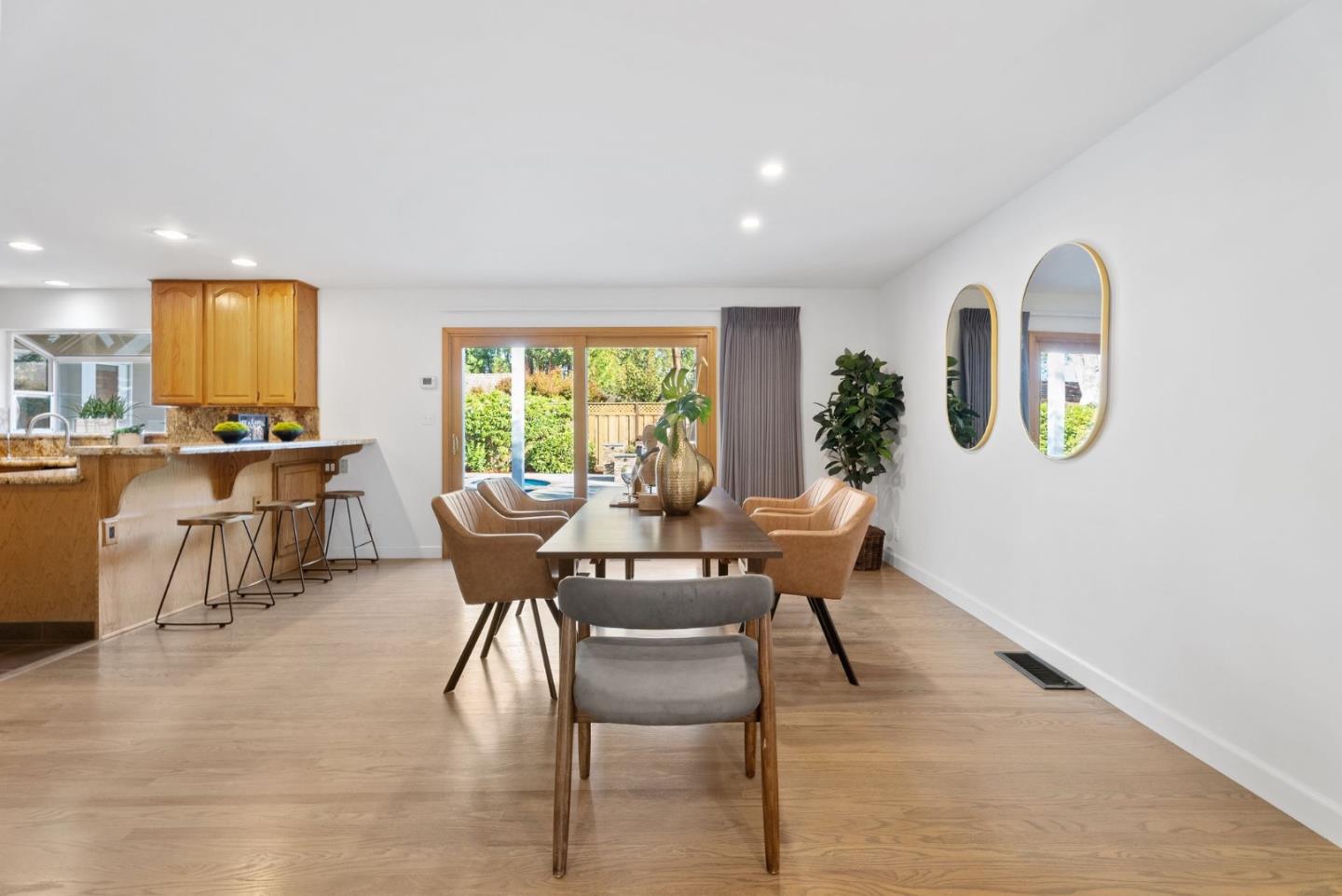 1081 Rockefeller Drive Sunnyvale, CA 94087 - Photo 8 of 24 a dining room with furniture and a floor to ceiling window