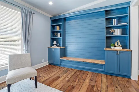 a bedroom with a bed and a bookshelf