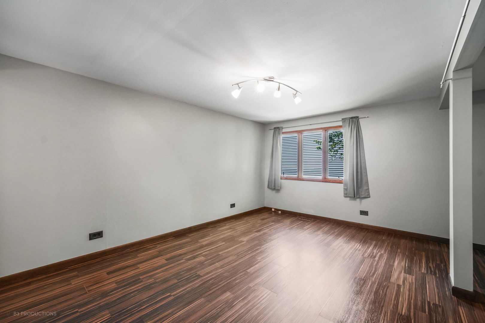 416 Green Valley Drive Naperville, IL 60540 - Photo 16 of 27 a view of an empty room with wooden floor and a window