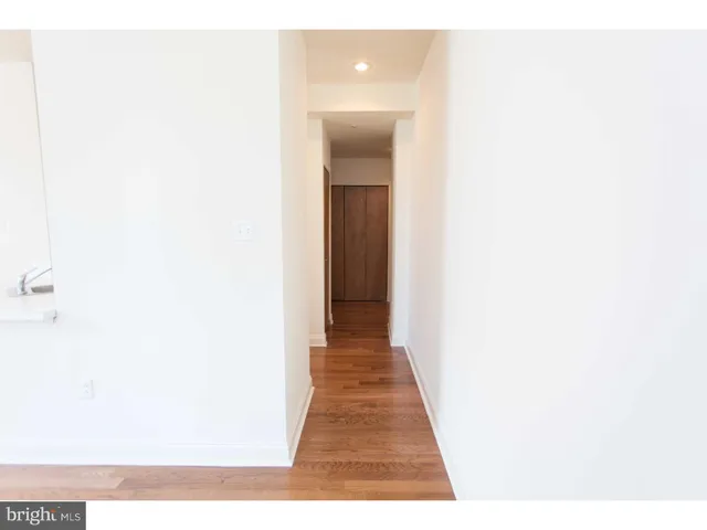 a hallway with wooden floor