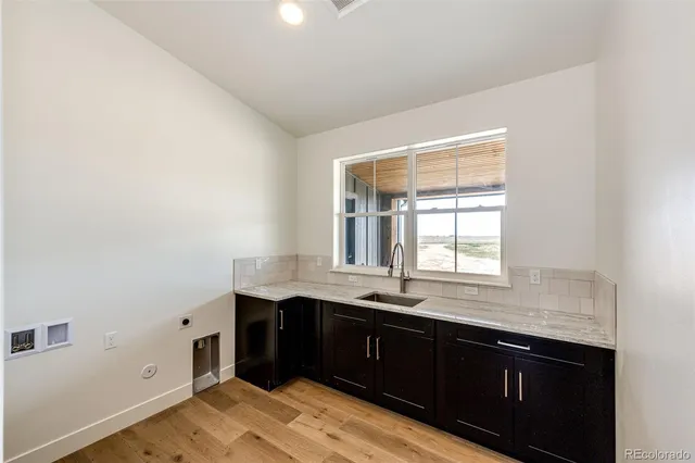 a kitchen with a sink and a window