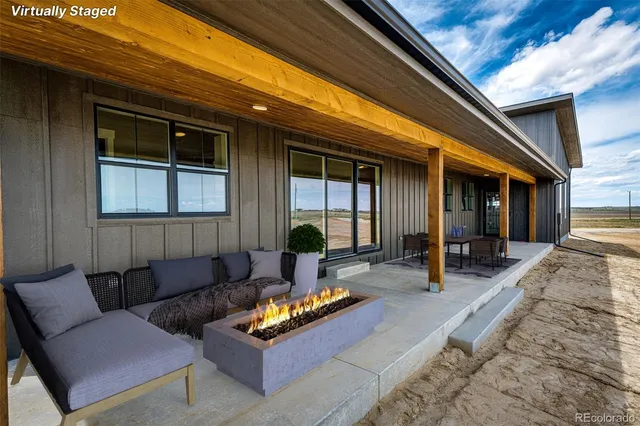 a outdoor living space with furniture and a potted plant