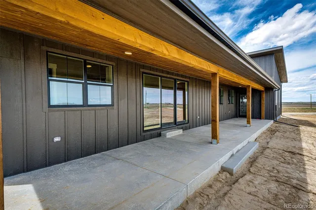 a view of backyard with large windows