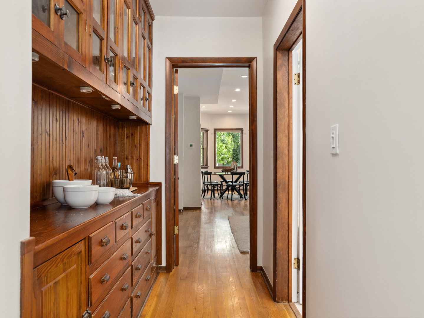 3034 North Seminary Avenue, Unit 2 Chicago, IL 60657 - Photo 12 of 26 a view of a hallway with wooden floor and a living room