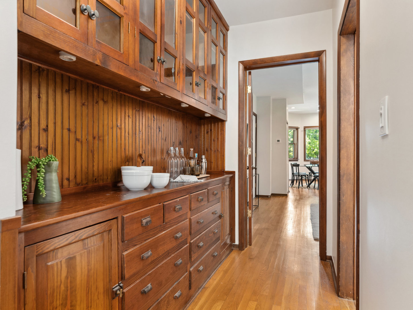 3034 North Seminary Avenue, Unit 2 Chicago, IL 60657 - Photo 13 of 26 a kitchen with granite countertop wooden cabinets a sink and dishwasher