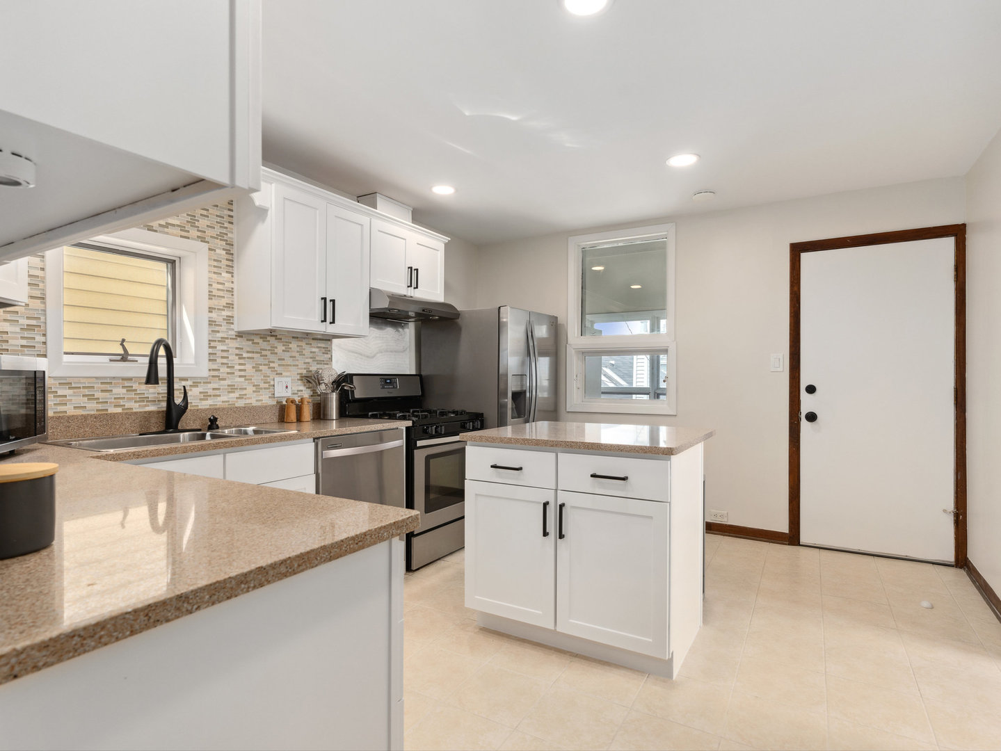 3034 North Seminary Avenue, Unit 2 Chicago, IL 60657 - Photo 17 of 26 a kitchen with a sink stove and refrigerator