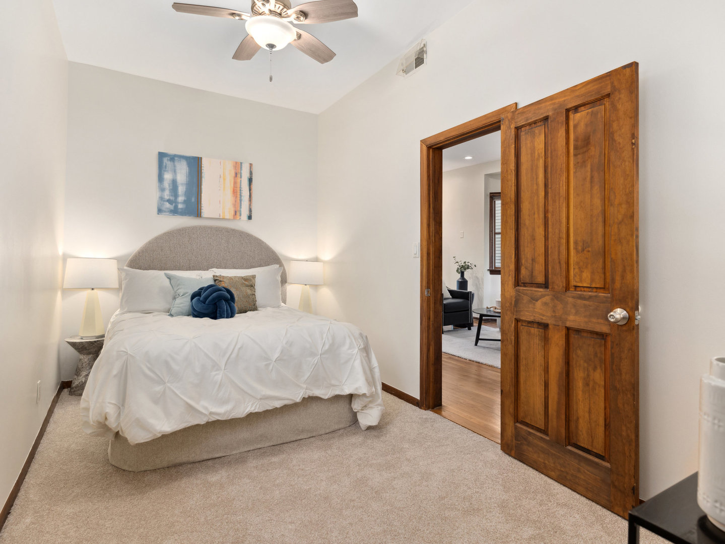 3034 North Seminary Avenue, Unit 2 Chicago, IL 60657 - Photo 18 of 26 a bedroom with a bed and a chandelier