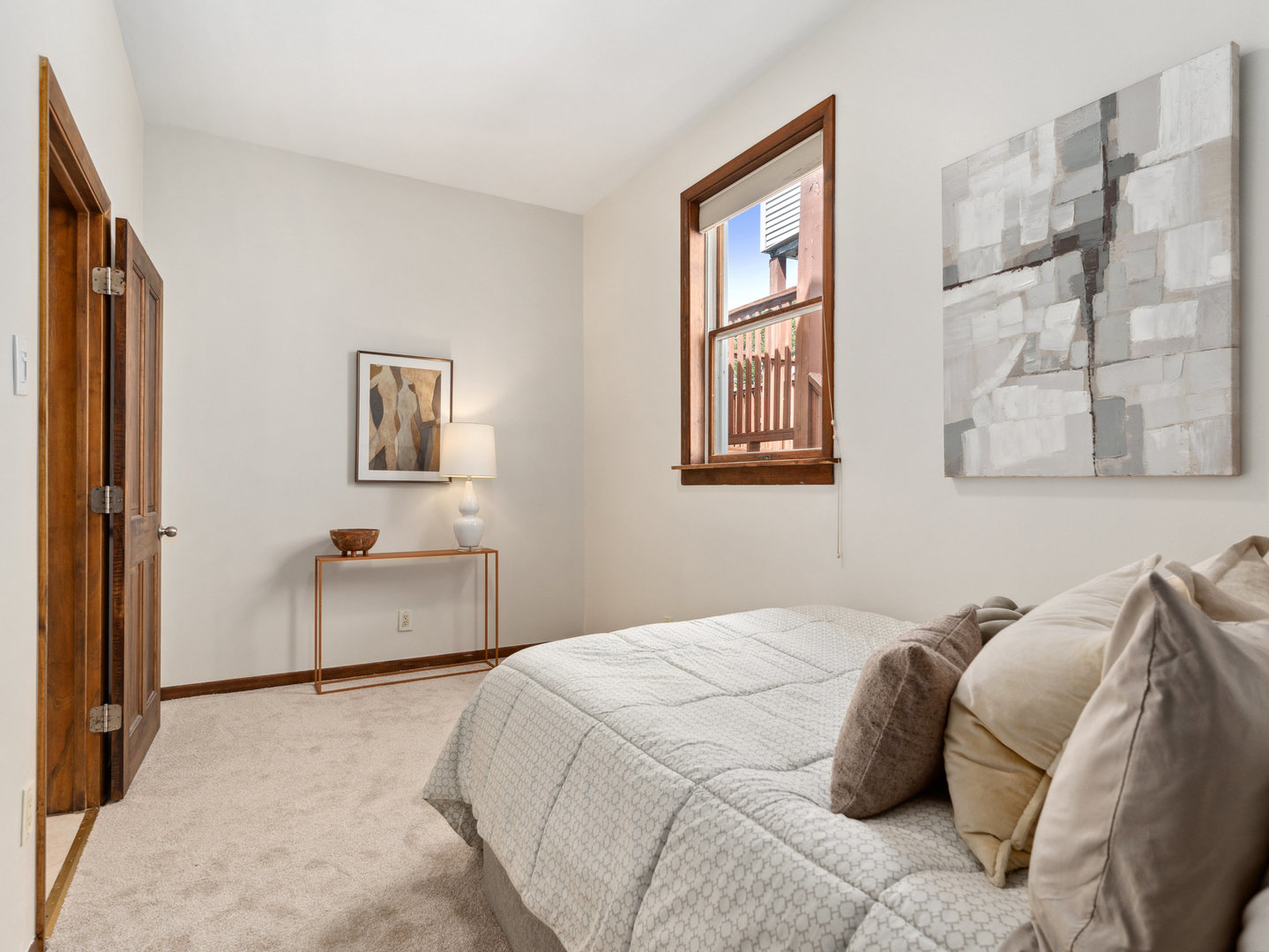 3034 North Seminary Avenue, Unit 2 Chicago, IL 60657 - Photo 19 of 26 a bedroom with a bed and a painting on the wall