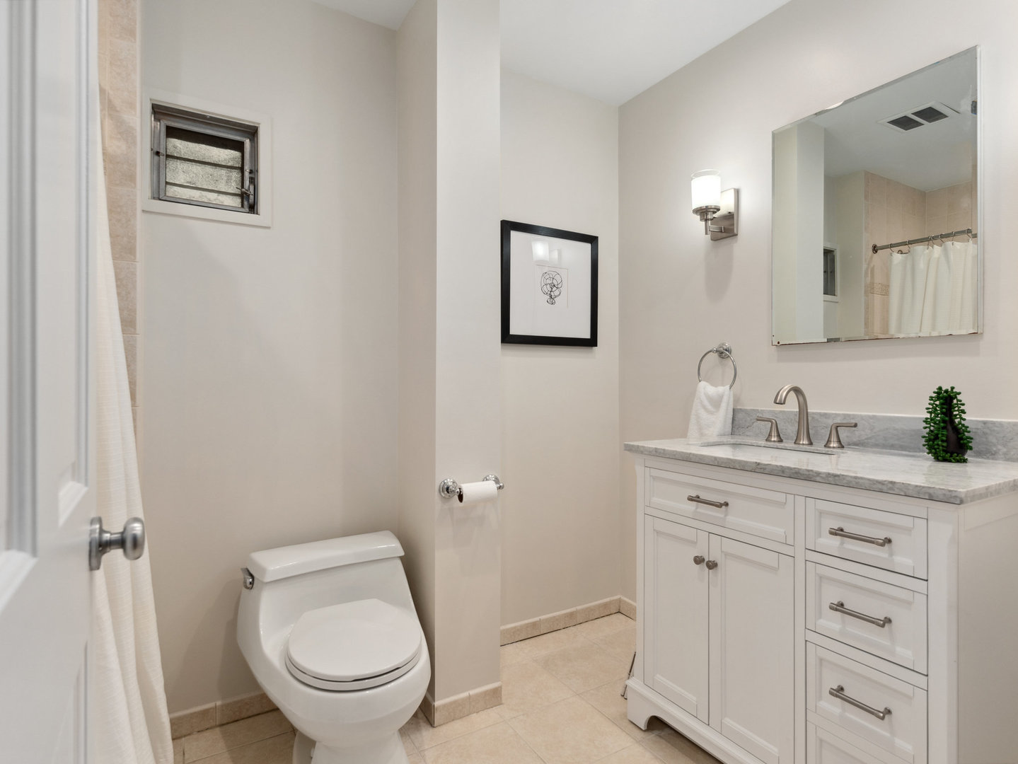 3034 North Seminary Avenue, Unit 2 Chicago, IL 60657 - Photo 20 of 26 a bathroom with a toilet a sink and mirror