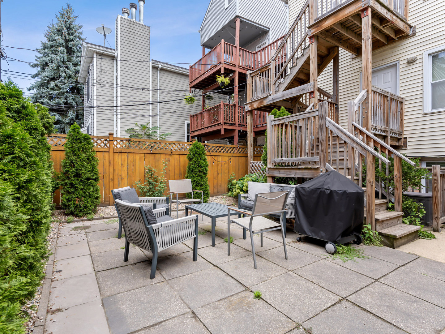 3034 North Seminary Avenue, Unit 2 Chicago, IL 60657 - Photo 25 of 26 a view of a patio with a table and chairs