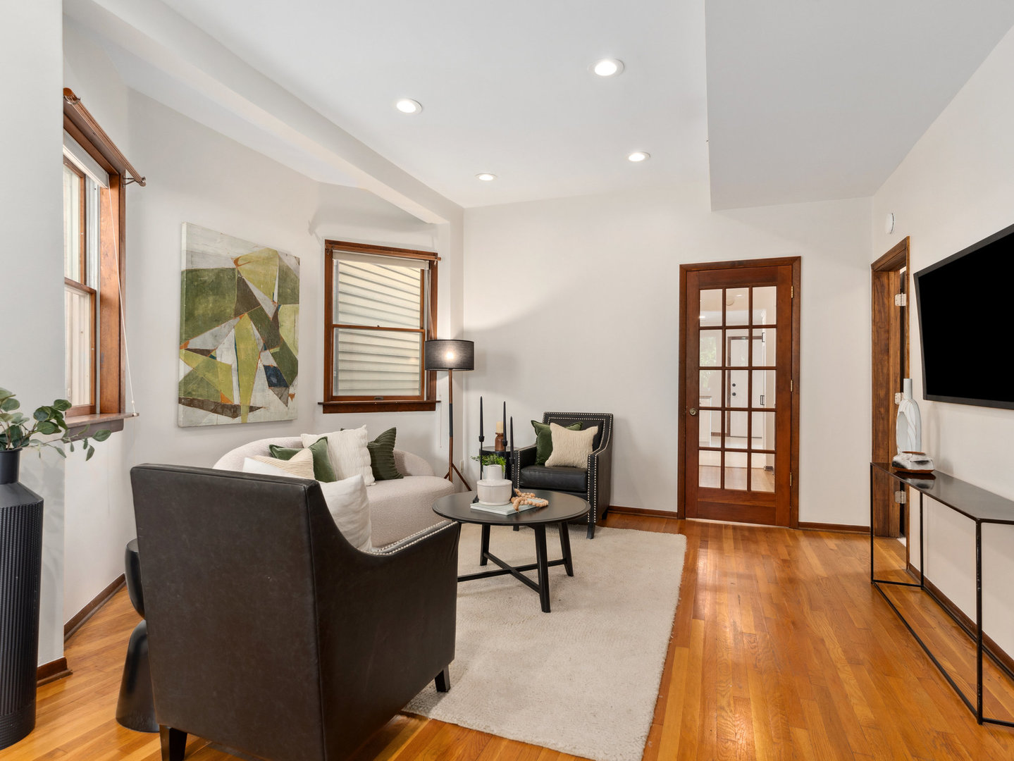 3034 North Seminary Avenue, Unit 2 Chicago, IL 60657 - Photo 7 of 26 a living room with furniture and a flat screen tv