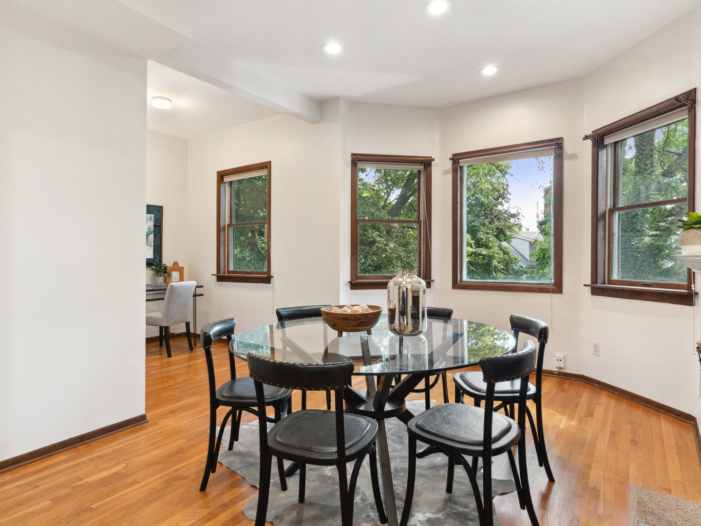 3034 North Seminary Avenue, Unit 2 Chicago, IL 60657 - Photo 8 of 26 a dining room with furniture and wooden floor
