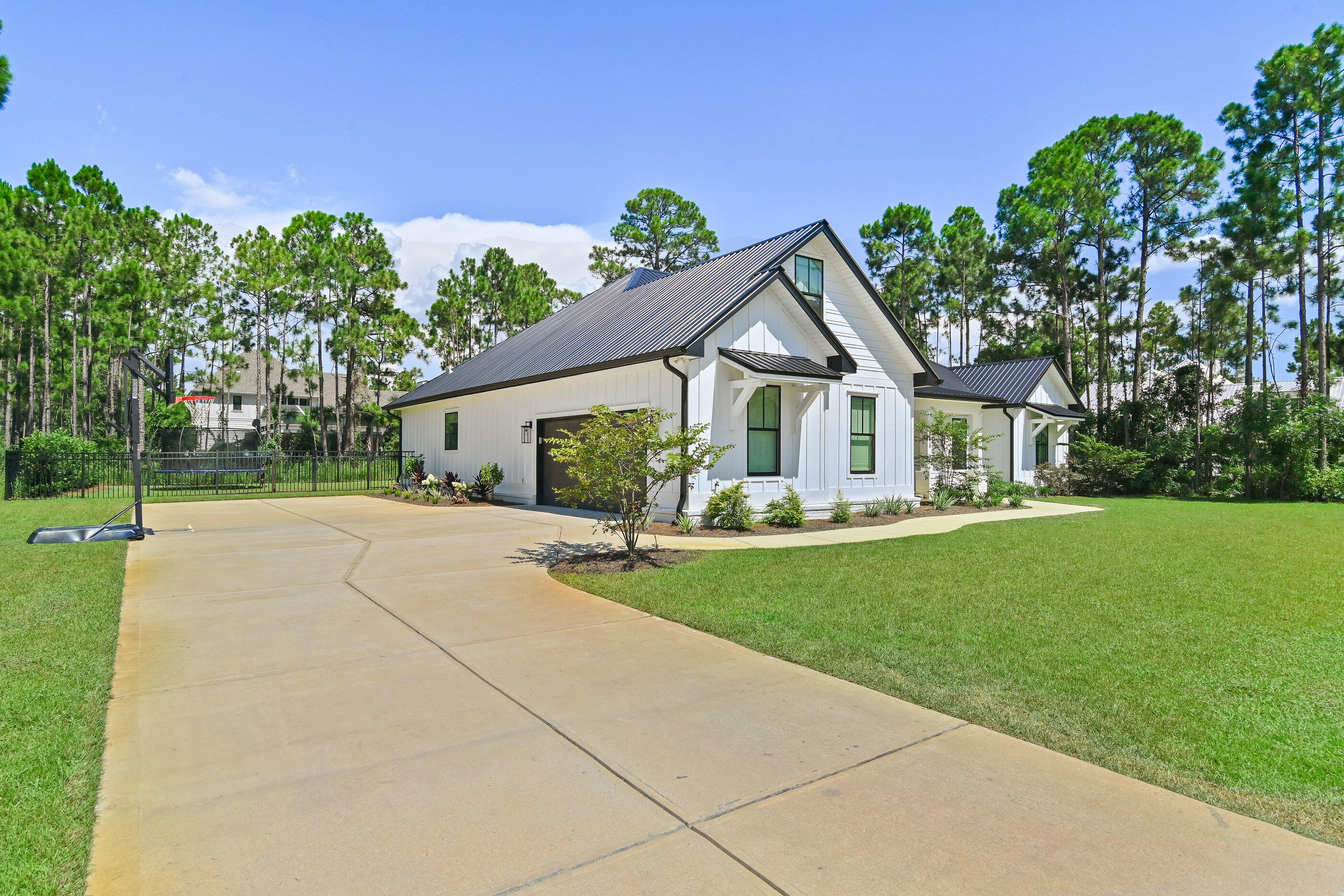515 Hideaway Circle Santa Rosa Beach, FL 32459 - Photo 4 of 58 a view of a house with backyard and garden