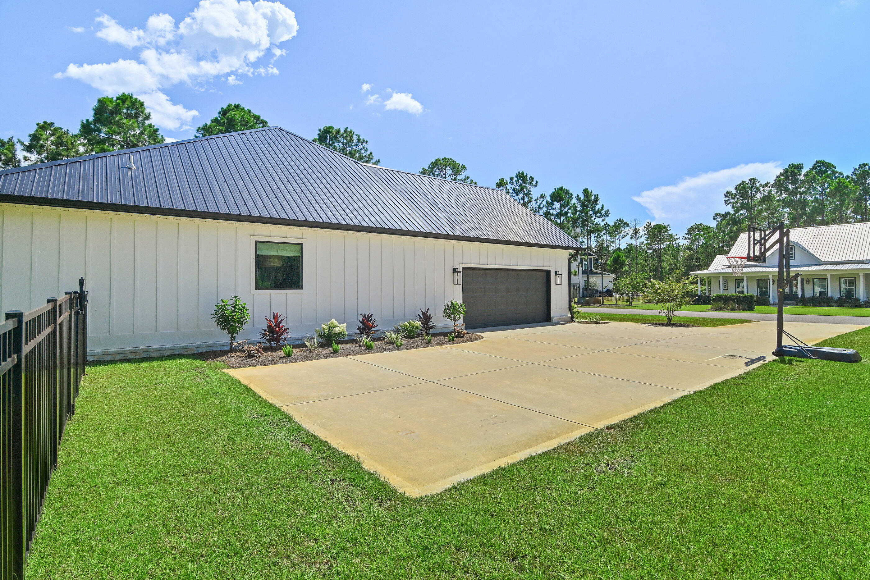 515 Hideaway Circle Santa Rosa Beach, FL 32459 - Photo 5 of 58 a view of a backyard with plants and a garden