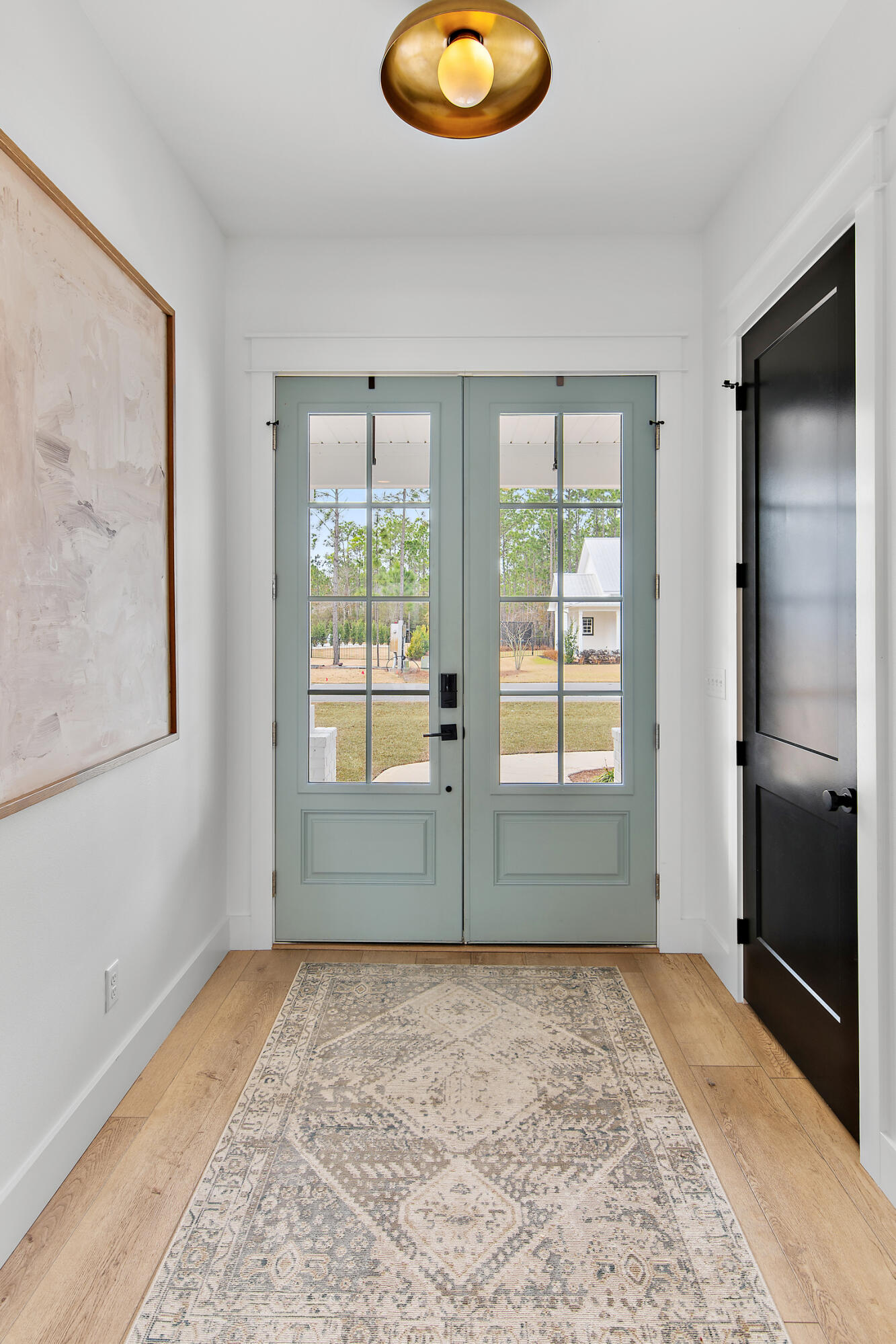 515 Hideaway Circle Santa Rosa Beach, FL 32459 - Photo 6 of 58 a view of empty room with wooden floor and fan