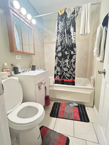 a bathroom with a bathtub and a toilet