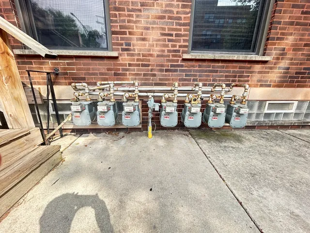 a view of a garage with parked cars