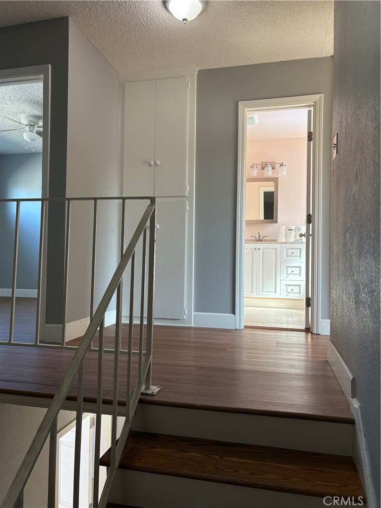 28 Paradise Valley North Carson, CA 90745 - Photo 11 of 17 a view of wooden floor in a hallway
