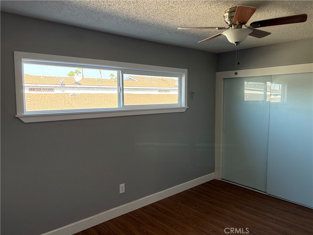 28 Paradise Valley North Carson, CA 90745 - Photo 14 of 17 a view of an empty room with wooden floor and a window
