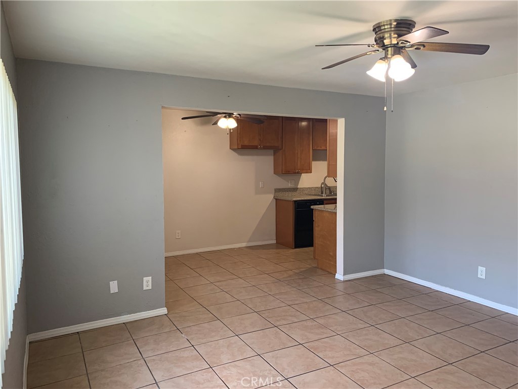 28 Paradise Valley North Carson, CA 90745 - Photo 2 of 17 an empty room with chandelier fan and windows