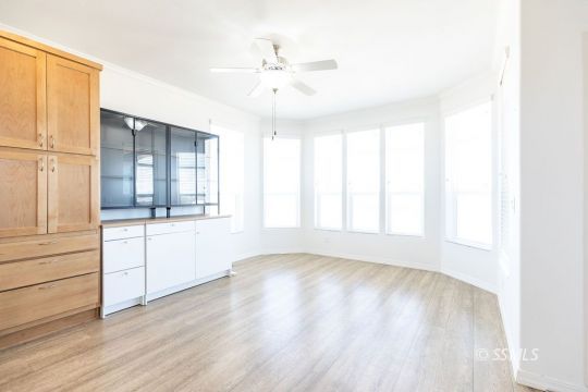 2014 South Brady Street Ridgecrest, CA 93555 - Photo 17 of 32 a view of an empty room with a window and wooden floor
