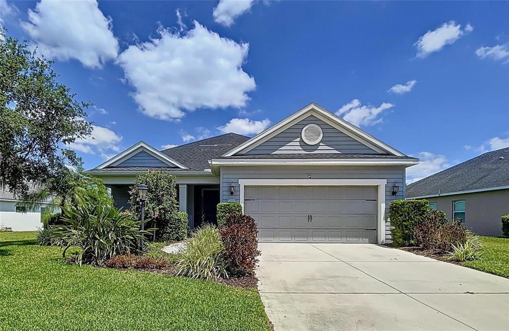 16848 Rosedown Glen Parrish, FL 34219 - Photo 1 of 1 a front view of a house with garden