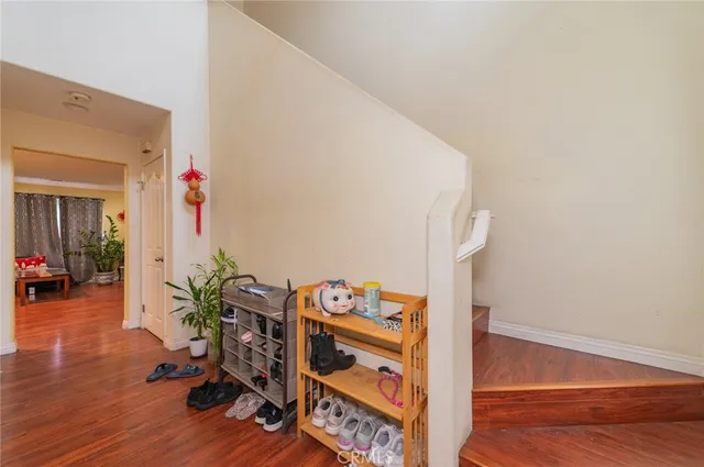 a view of an entryway with wooden floor