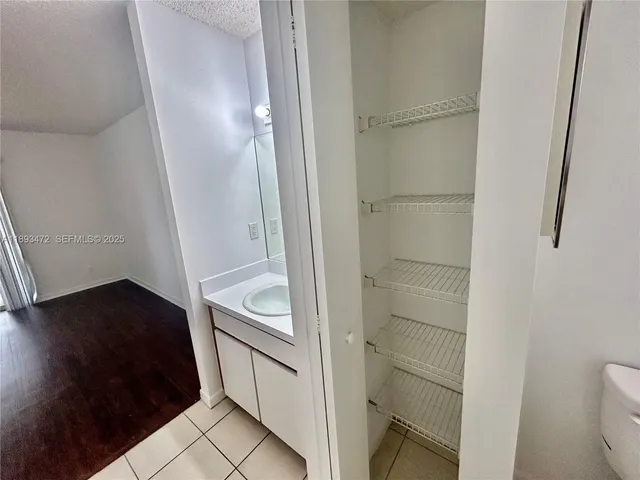 a kitchen with a cabinets and a stove top oven