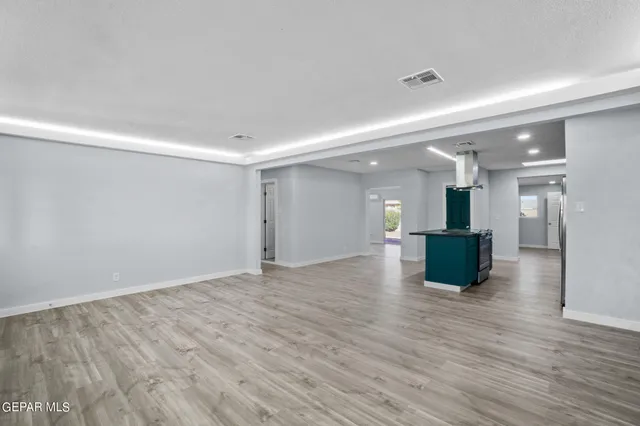 a view of kitchen with cabinets and wooden floor