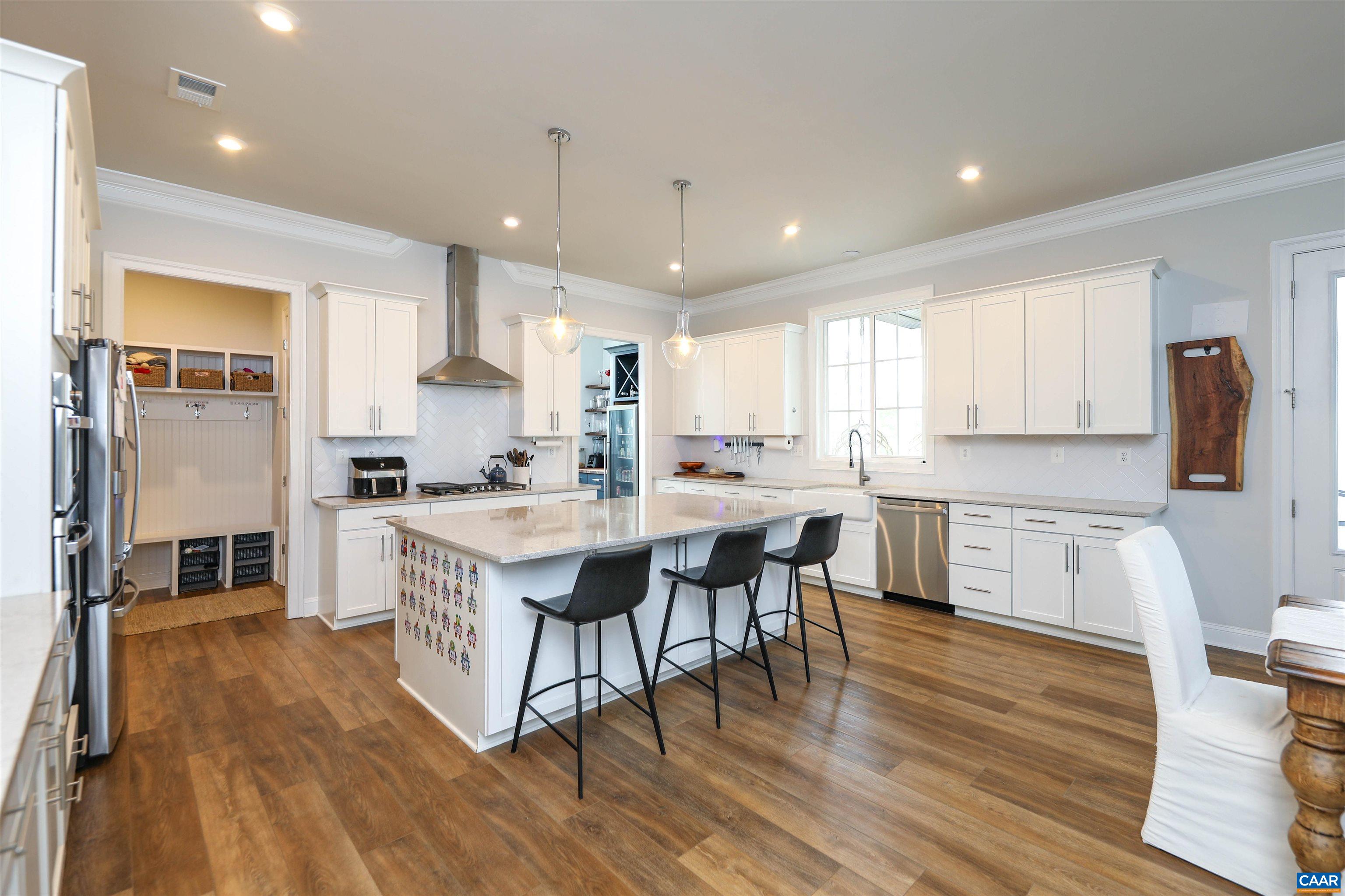 2483 Ferndown Lane Keswick, VA 22947 - Photo 10 of 54 a kitchen with a sink a counter top space stainless steel appliances and cabinets