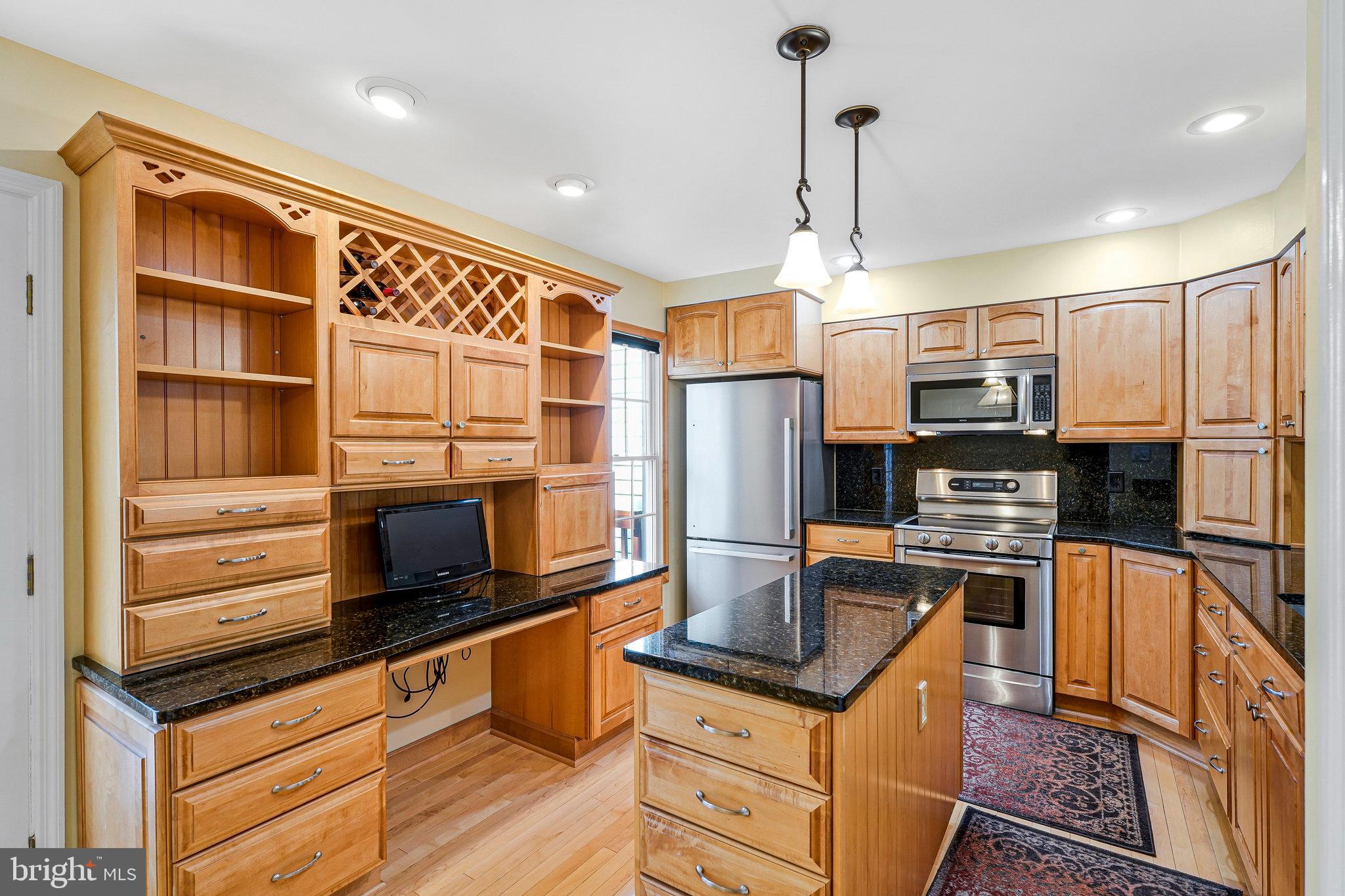 6556 Antrican Drive Springfield, VA 22150 - Photo 11 of 36 a kitchen with a refrigerator stove and microwave