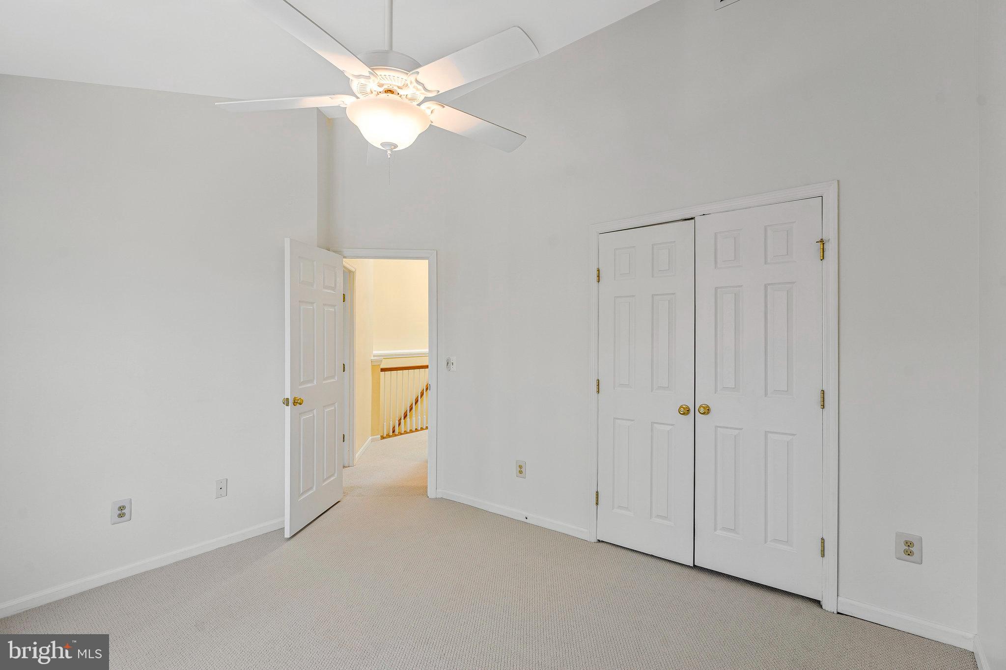 6556 Antrican Drive Springfield, VA 22150 - Photo 20 of 36 a view of an empty room with a ceiling fan
