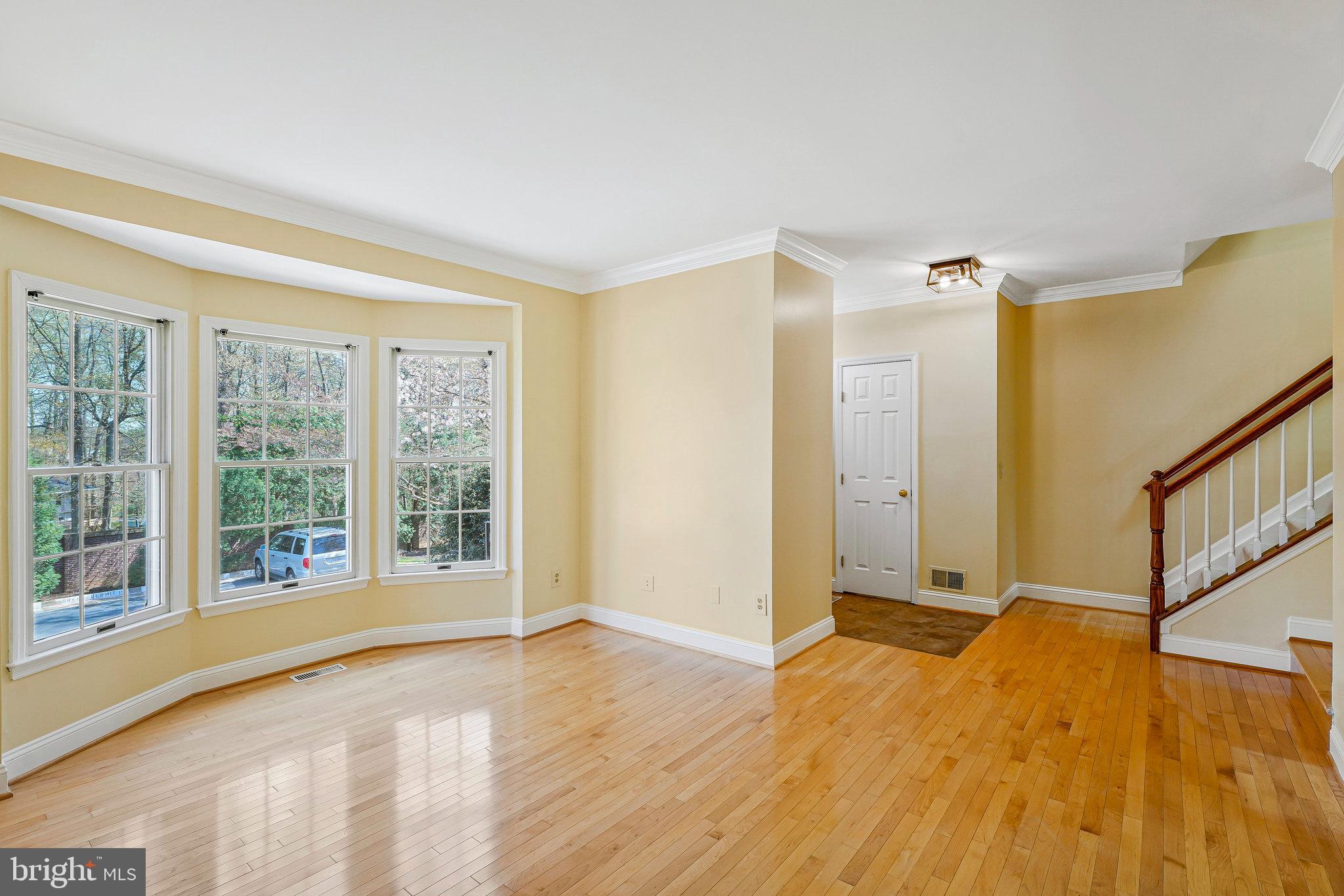 6556 Antrican Drive Springfield, VA 22150 - Photo 4 of 36 a view of an empty room with wooden floor and a window