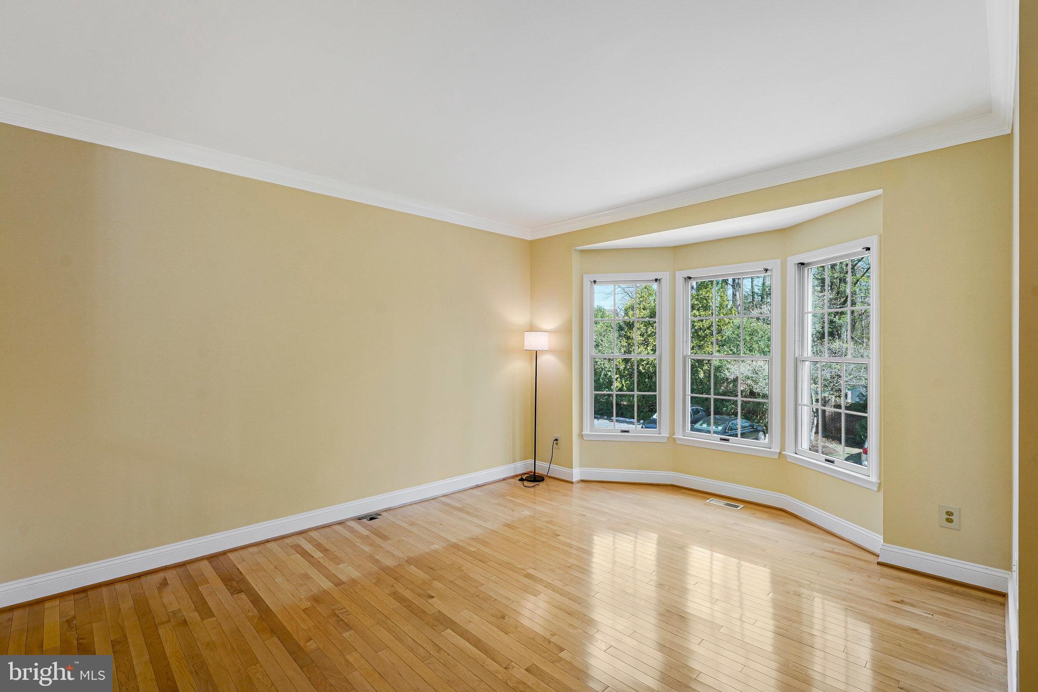 6556 Antrican Drive Springfield, VA 22150 - Photo 5 of 36 a view of an empty room with wooden floor and a window
